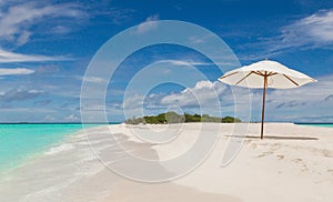 Beach umbrella on the beach Atoll island Maldives