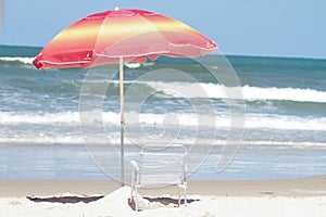 beach umbrella and chair on ilheus beach photo