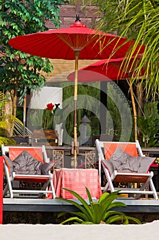 Beach umbrella and deck chairs on the beach