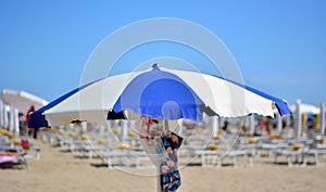 A beach umbrella open to the summer sun