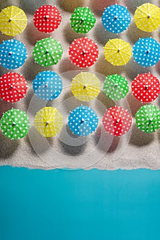 Beach Umbrella Pattern View From Above on Sandy Beach. Still Life Art