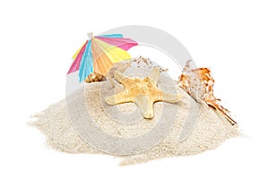 Beach umbrella with seashells on heap of sand. Isolated on white