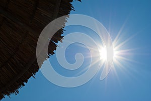 Beach umbrella and sun