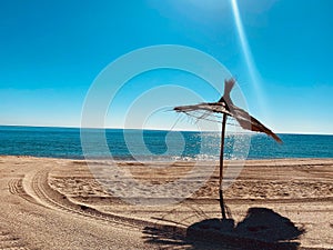 Beach umbrella on a sunny day in the mediterranean sea in Morocco