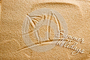 A beach umbrella and a surfboard are painted on the sand and an inscription of summer holidays. Beach background. View from above