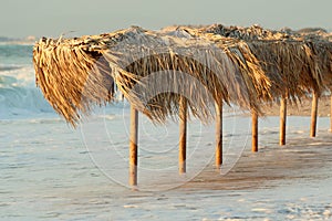 Beach umbrellas in Agios Ioannis Beach, Lefkada, Greece.