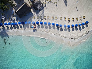 Beach Umbrellas on a Beautiful White Sand Beach - Aerial View photo
