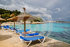 Beach umbrellas and chaise lounges at Playa de Illetes beach