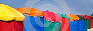 Beach umbrellas, Deauville, Normandy France. Colorful web banner