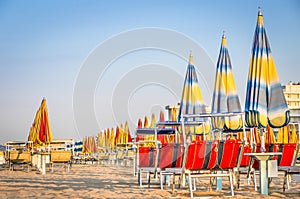 Beach Umbrellas at the end of the Season - Rimini Beach, Italy photo