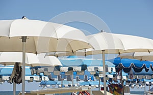 Beach umbrellas, gazebos and sun beds at Italian sandy beaches. Adriatic coast. Emilia Romagna, Itsly