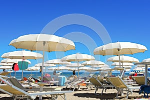 Beach umbrellas, gazebos and sun beds at Italian sandy beaches. Adriatic coast. Emilia Romagna, Itsly