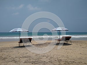 beach with umbrellas, Kovalam beach, seascape view, Thiruvananthapuram Kerala