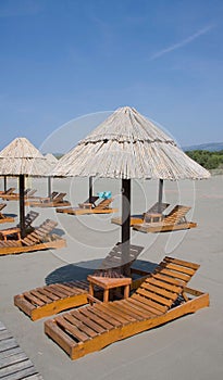Beach umbrellas and lounge chairs