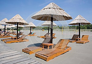 Beach umbrellas and lounge chairs