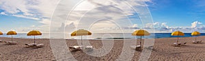 Beach with umbrellas and sun beds