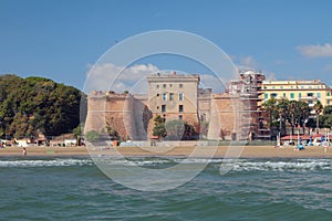 Beach under walls of ancient fortress. Nettuno, Lazio, Italy