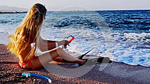 Beach vacation of girl sitting on sand beach in sea