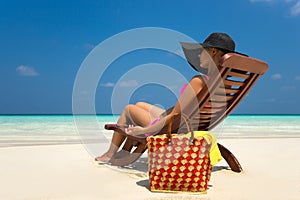 Beach vacation. Hot beautiful woman enjoying looking view of beach