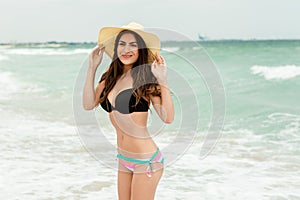 Beach vacation woman in sun smiling happy