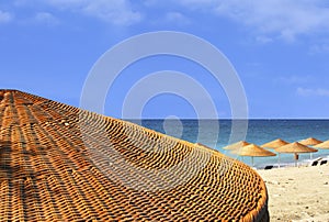 Beach view behind umbrella