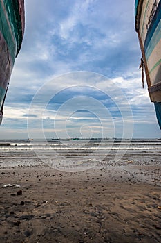 Beach view with fishing boats at early in the morning from flat angle