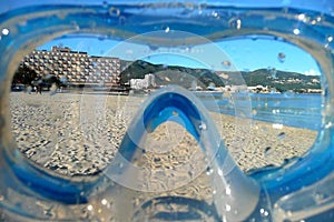 Beach view through a snorkel mask