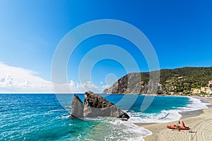 Beach in the village Monterosso al Mare on shore of the Mediterranean Sea in Italy photo