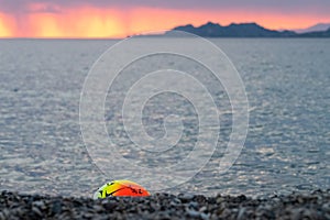 Beach volley ball against a vivid and colorful sunset.