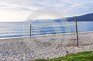 Beach volley court with sea background
