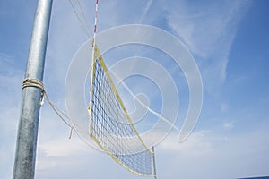 Beach volley net on a sandy beach