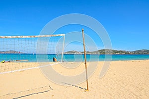 Beach volley net and surfboards in Porto Pollo