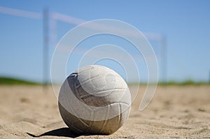 Beach volleyball with blue sky and net
