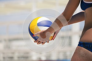 Beach volleyball female player and ball game