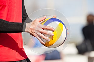 Beach volleyball player, playing summer. Hands with ball