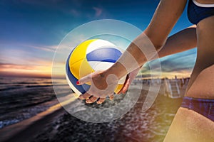 Beach volleyball player, playing summer. Woman with ball