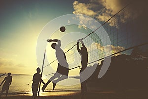 Beach Volleyball at Sunset Enjoyment Concept photo