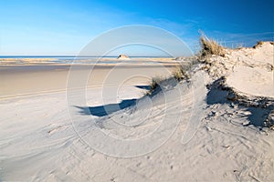 Beach walk o on the endless wide, sandy beach of  Norderney Island in February