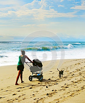 Beach walking with baby carriage