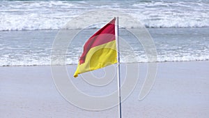 Beach Warning Flags to indicate the sea hazard on a sandy beach