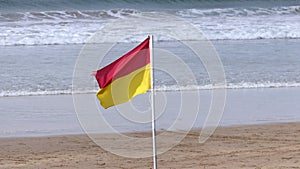 Beach Warning Flags to indicate the sea hazard on a sandy beach