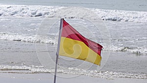 Beach Warning Flags to indicate the sea hazard on a sandy beach