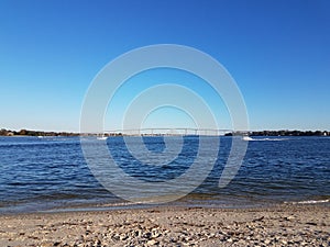 beach and water and bridge at Solomons Island Maryland with boats