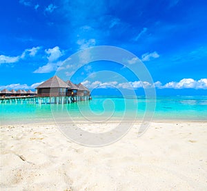 Beach with water bungalows Maldives