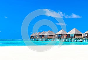 Beach with water bungalows Maldives