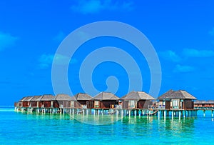 Beach with water bungalows Maldives