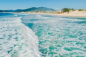 Beach with waves in Brazil. Aerial view of Campeche beach