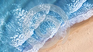 Beach and waves from top view. Aerial view of luxury resting at sunny day. Summer seascape from air. Top view from drone.