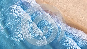 Beach and waves from top view. Summer seascape from air. Top view from drone.