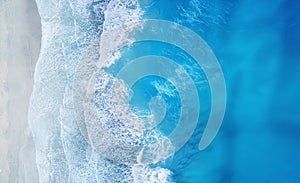 Beach and waves from top view. Turquoise water background from top view. Summer seascape from air. Top view from drone.